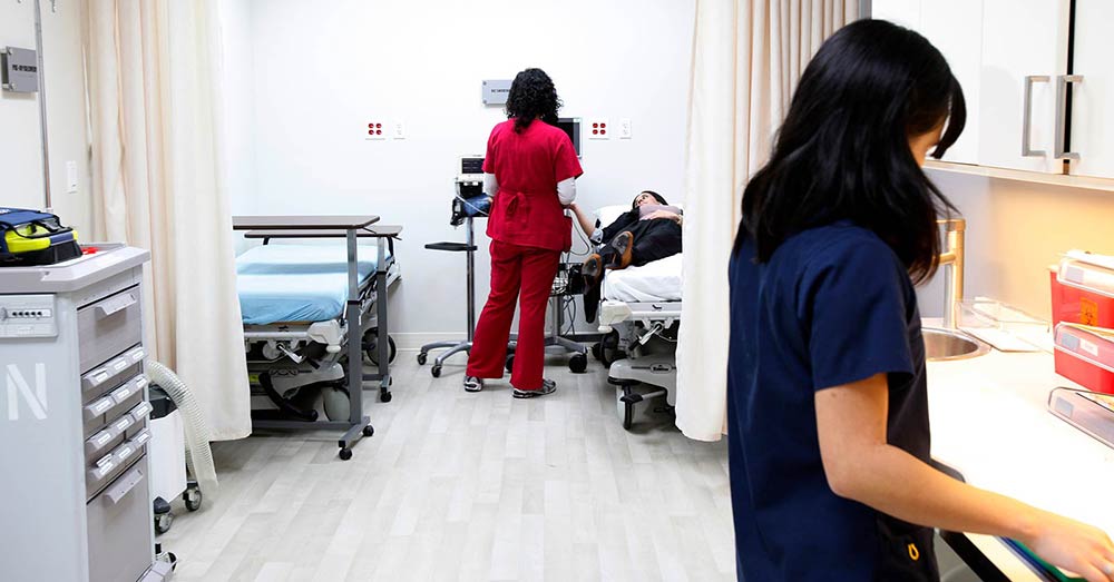 Nurses Helping Patient