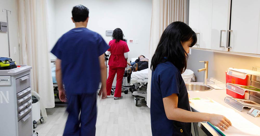 Nurses Assisting Patient